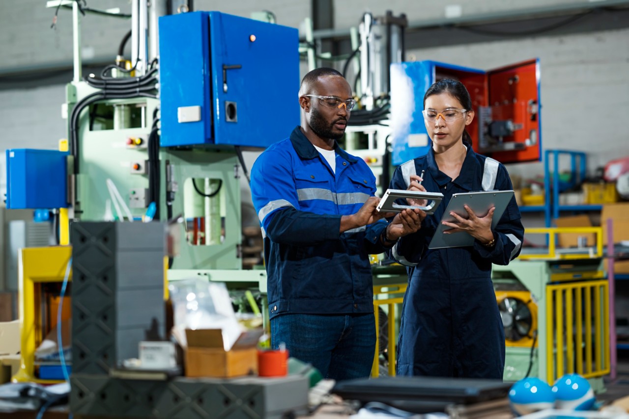 two-mechanical-engineers-in-safety-goggles-looking-at-a-piece-of-equipment-getty-1342771243.jpg