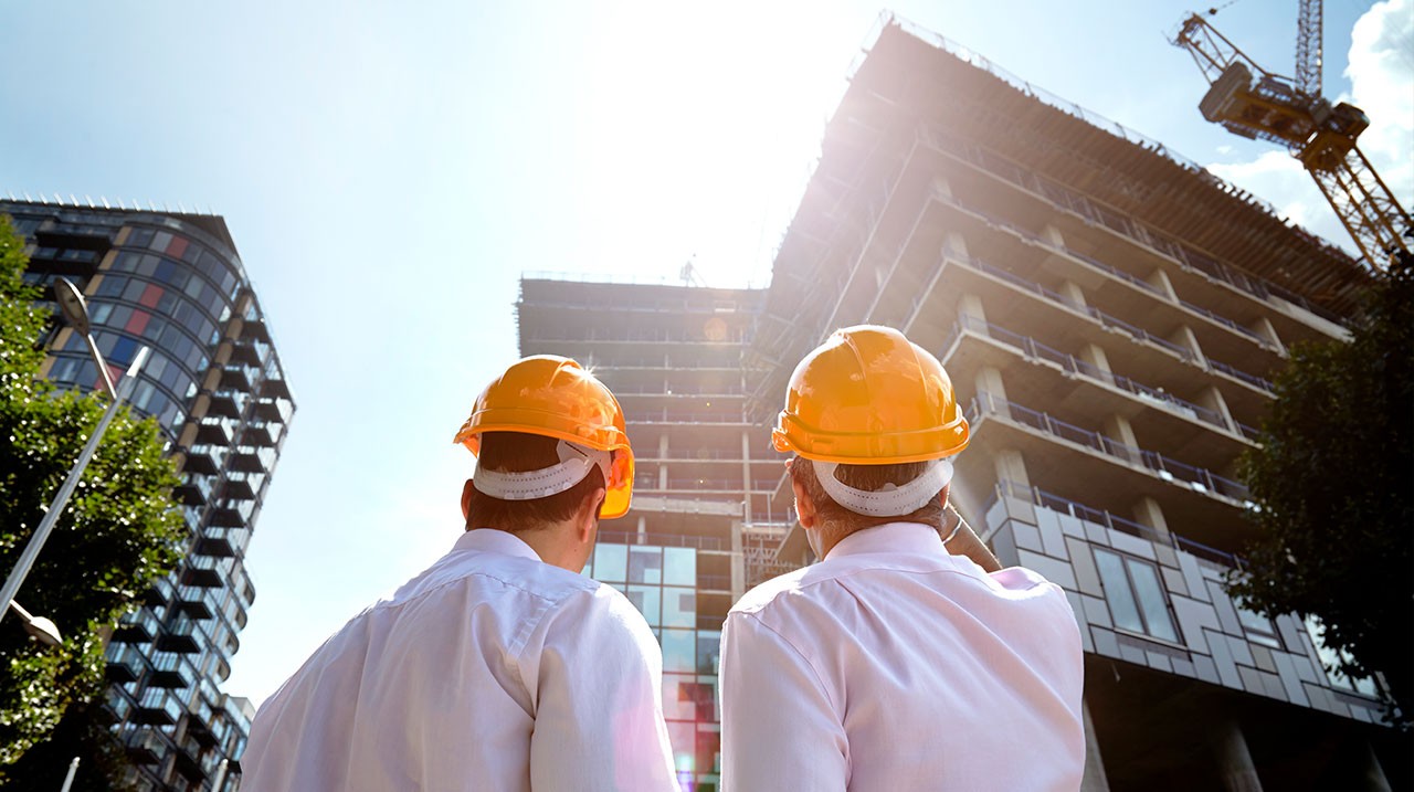 building-engineers-in-hard-hats-construction-site.jpg