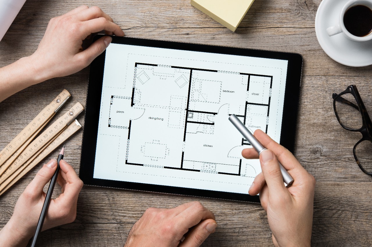 house-layout-plan-tablet-with-hands-around.jpg
