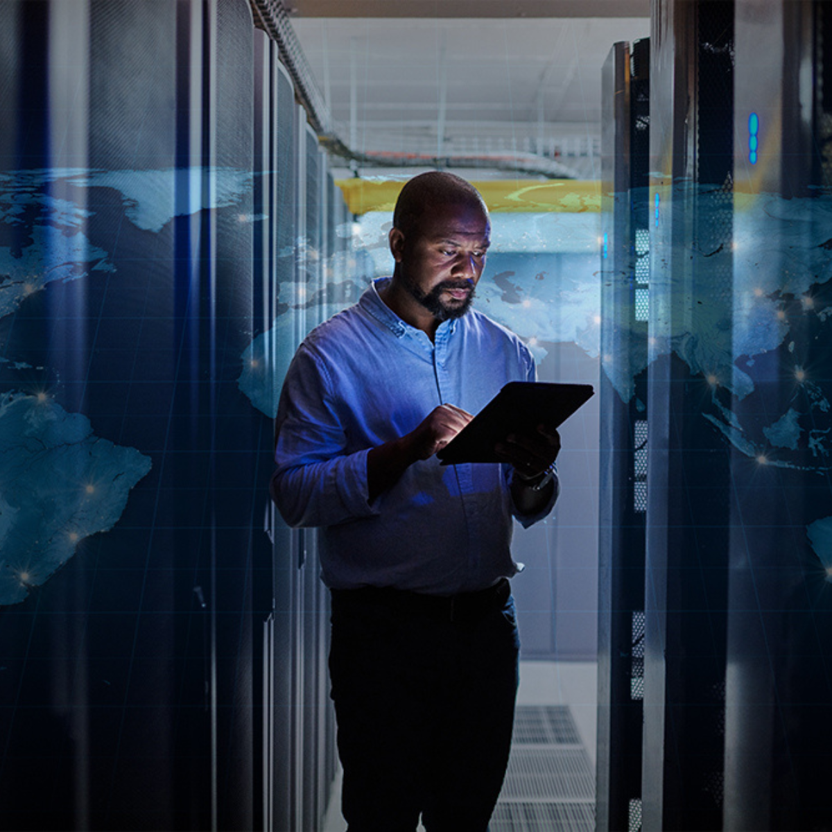 Man in data center using tablet with map of the world overlay - 1200x1200.png